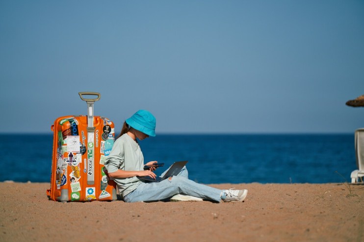 Sun, sea and Slack: As many Brits plan to work from abroad – what are the actual rules?